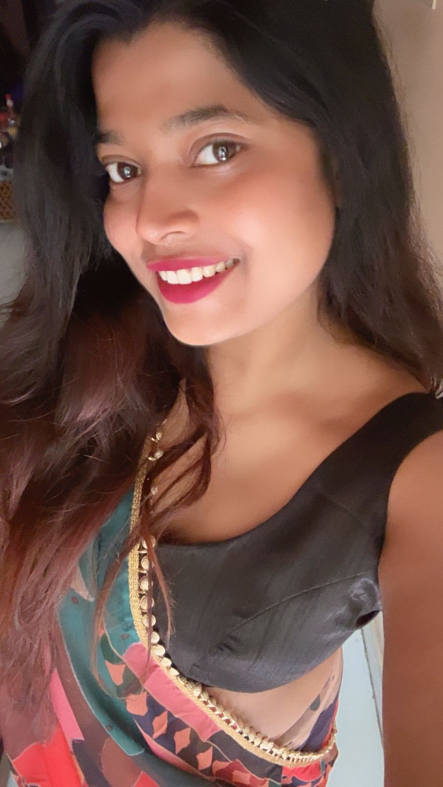 Nishtha after breast reduction - close-up selfie in saree with fitted blouse, smiling confidently